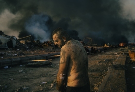 BEIRUT, LEBANON - AUGUST 4:
An injured man stands inside the wrecked site of the port of Beirut while firefighters work to put out the fires that engulfed the warehouses after the explosion.
(Photo by Lorenzo Tugnoli/ Contrasto for The Washington Post)