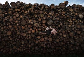 KOCHEL AM SEE, GERMANY - SEPTEMBER 15: Georg Filser-Mayerhofer of Germany climbs a log pile while doing some bouldering training in Kochel on September 15, 2020 in Kochel Am See, Germany. The rock climbing gyms and sports facilities in Munich have been closed due to the ongoing Covid 19 pandemic, so athletes have had to become creative in their training methods during this unprecedented time.